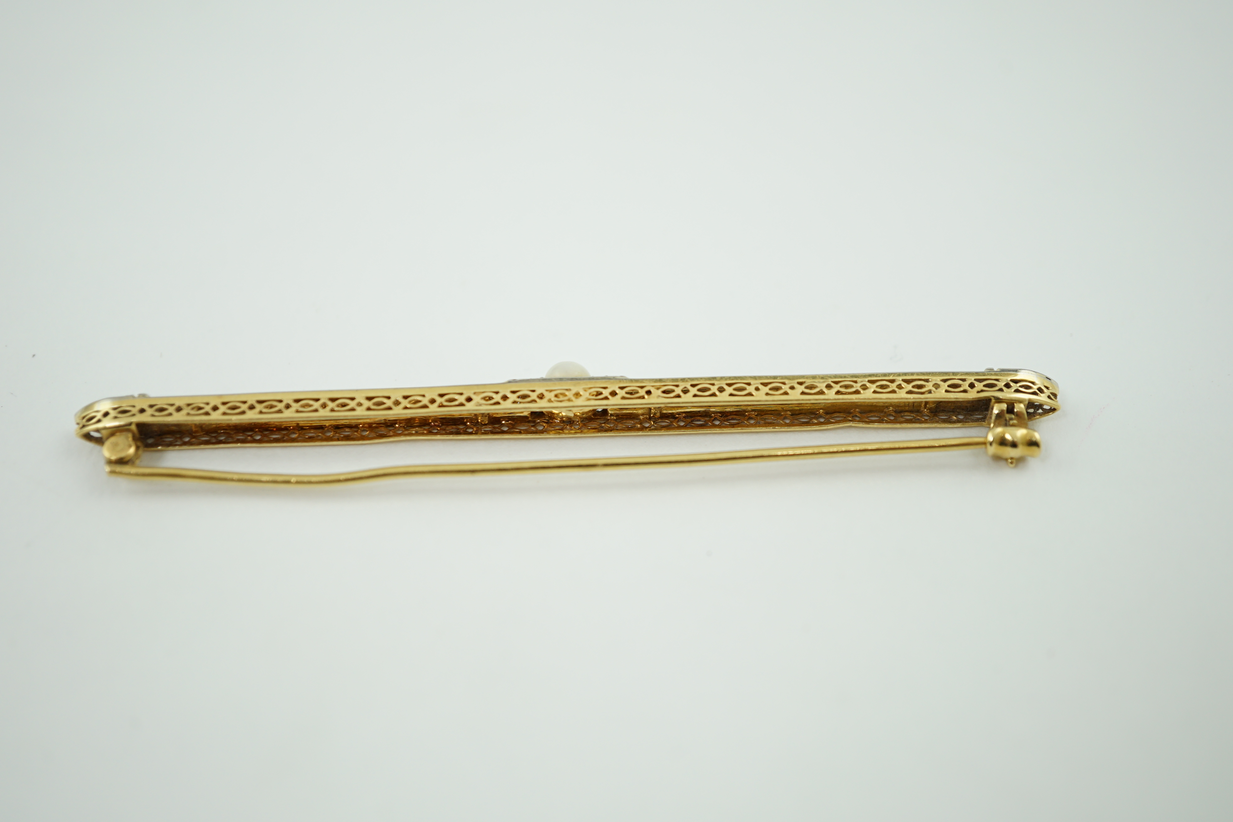 A 1940's 18ct gold, enamel, diamond chip and split pearl set bar brooch